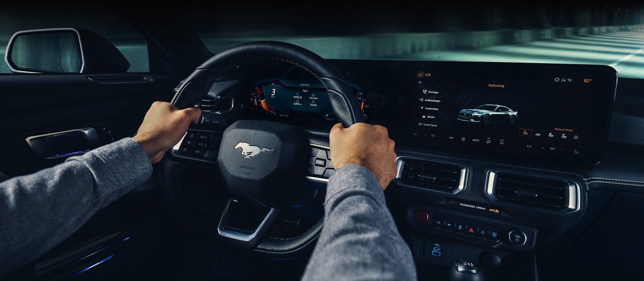 A 2024 Ford Mustang® model interior with a person driving | Roland Rich Ford, Inc. in Delavan IL